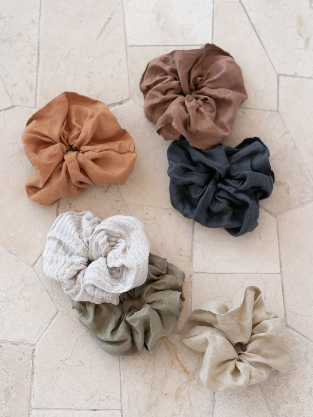 Image features Jumbo Linen Scrunchie in Cinnamon, Charcoal, Moss, Flax, Sand and Linen Blend.