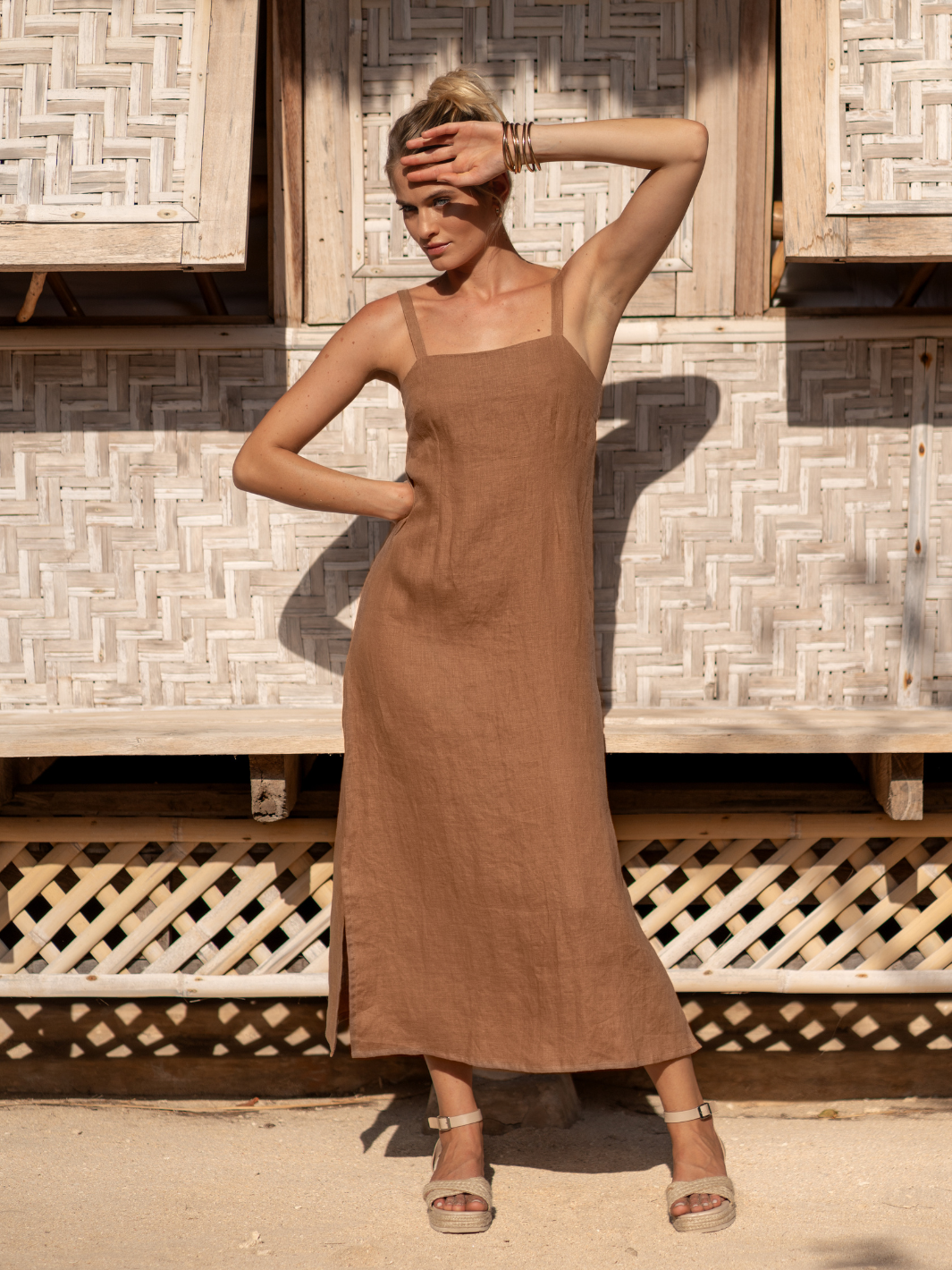 Model wears Mahlia Linen Midi Dress in Desert Sand