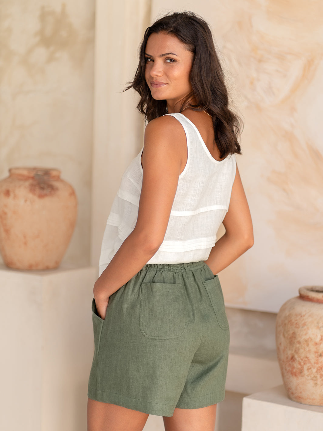 Model wears Charli Linen Shorts in Olive