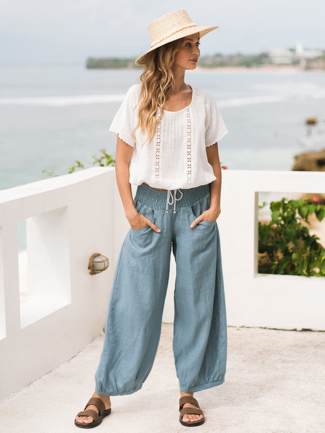 Model wears Daisy Organic Cotton Blouse in Ivory