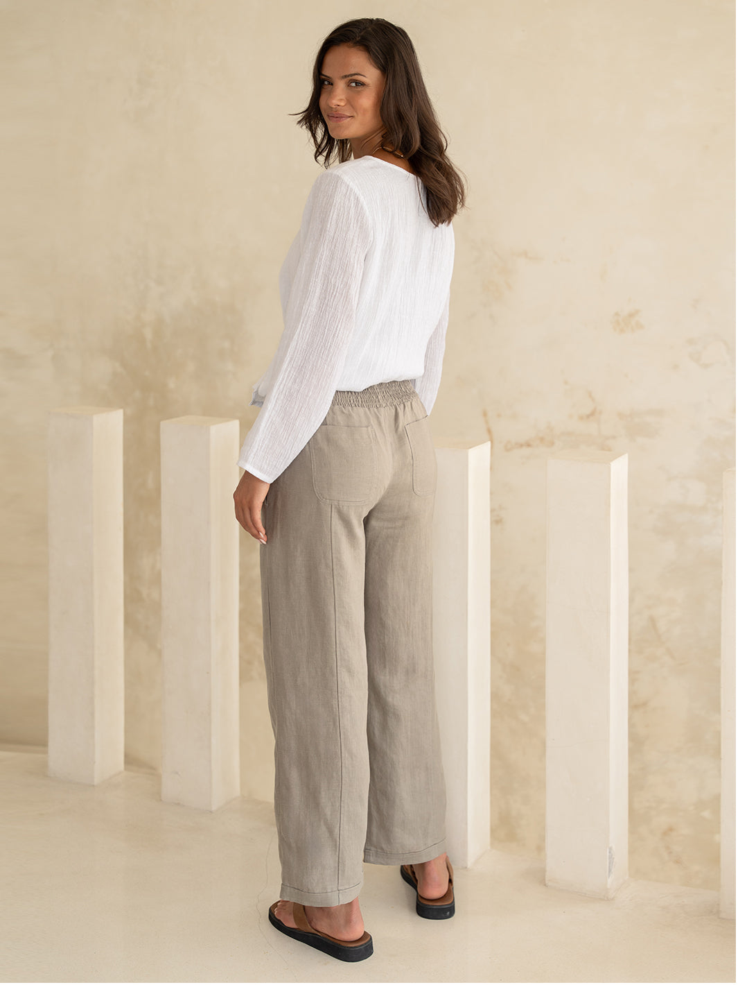 Model wears Morrissey Linen Pants in Taupe
