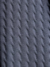 Close-up of a textured gray sweater fabric