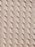 Close-up of textured beige fabric with a cable knit pattern