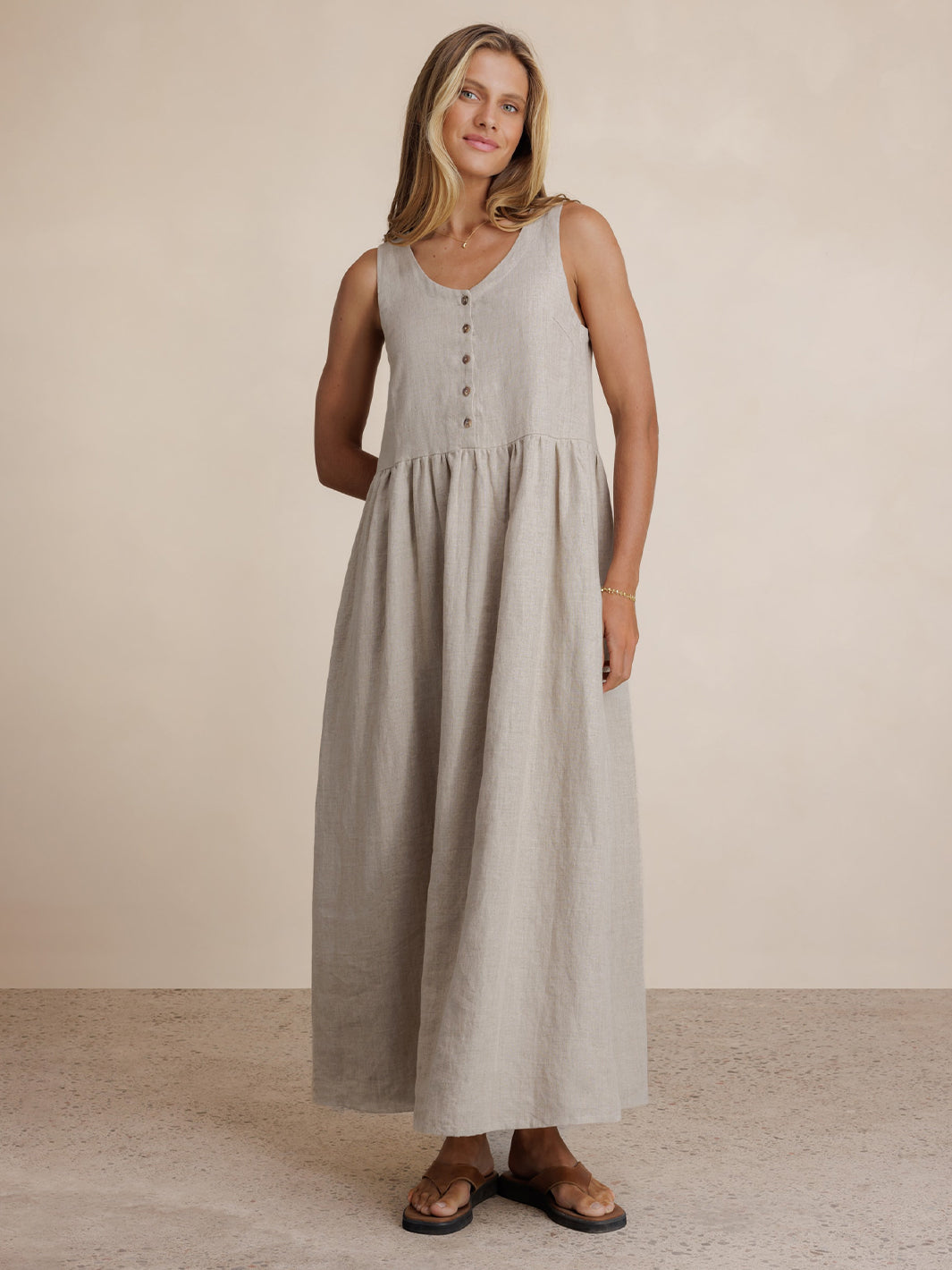 Model wears Saffron Linen Maxi Dress in Flax