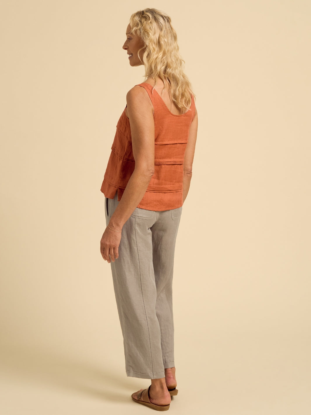 Model wears Stella Linen Top in Rust