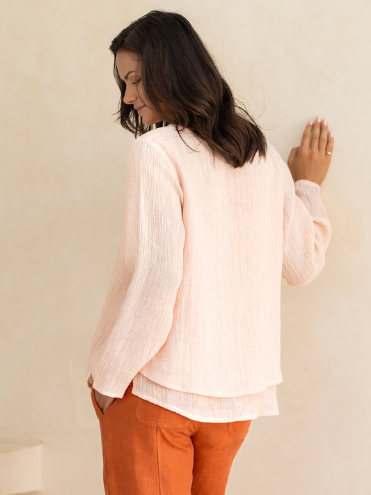 Model wears Viola Linen Top in Coral
