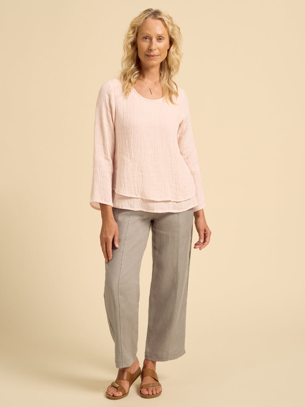 Model wears Viola Linen Top in Coral