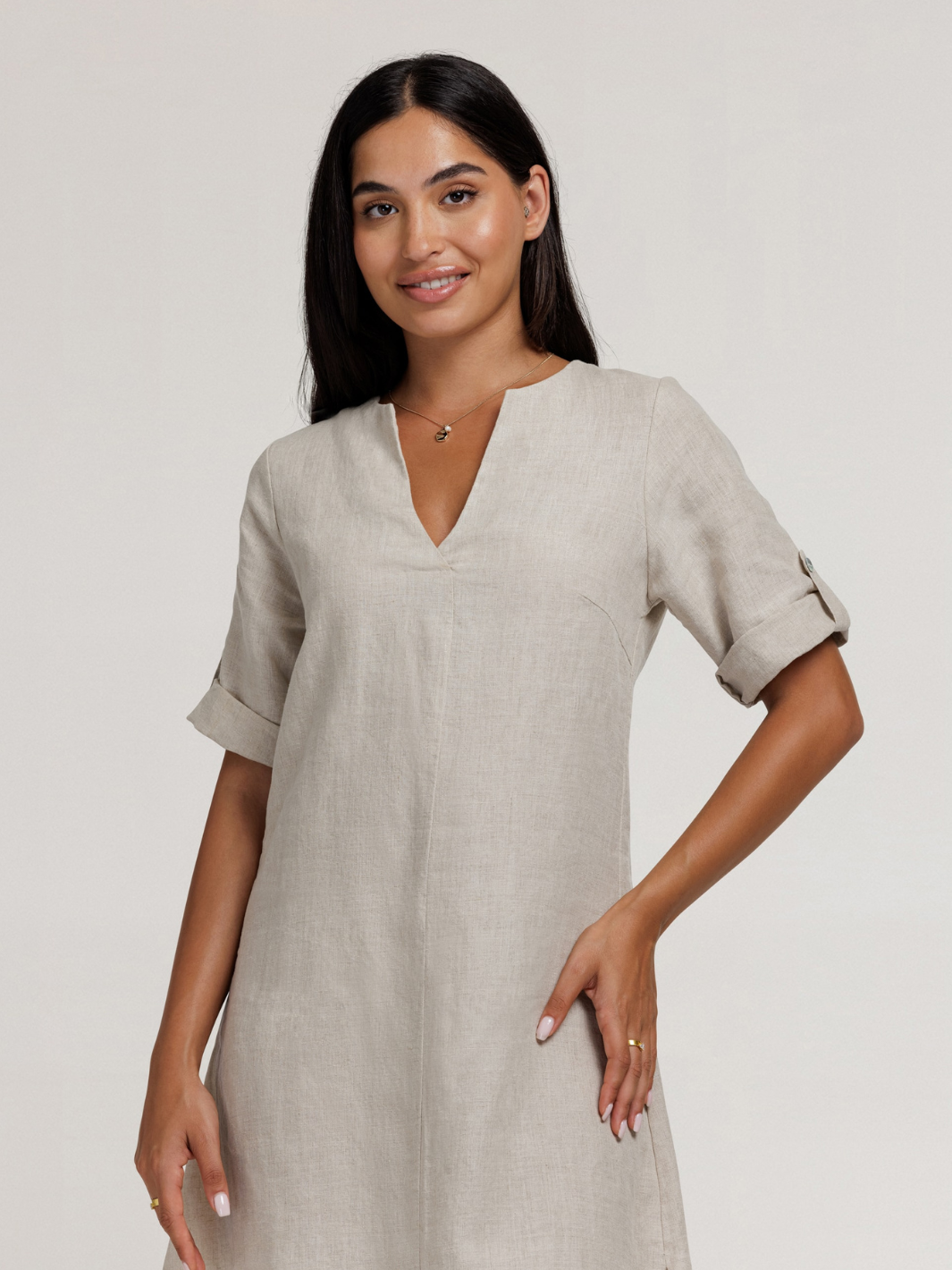 Model wears Elyse French Linen Midi Dress in Flax