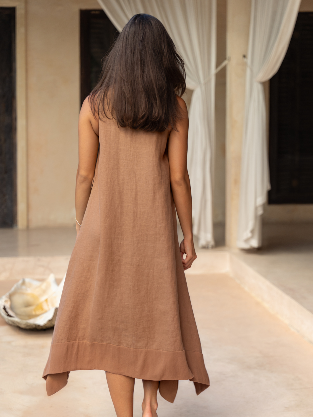 Model wears Inez Linen Midi Dress in Desert Sand