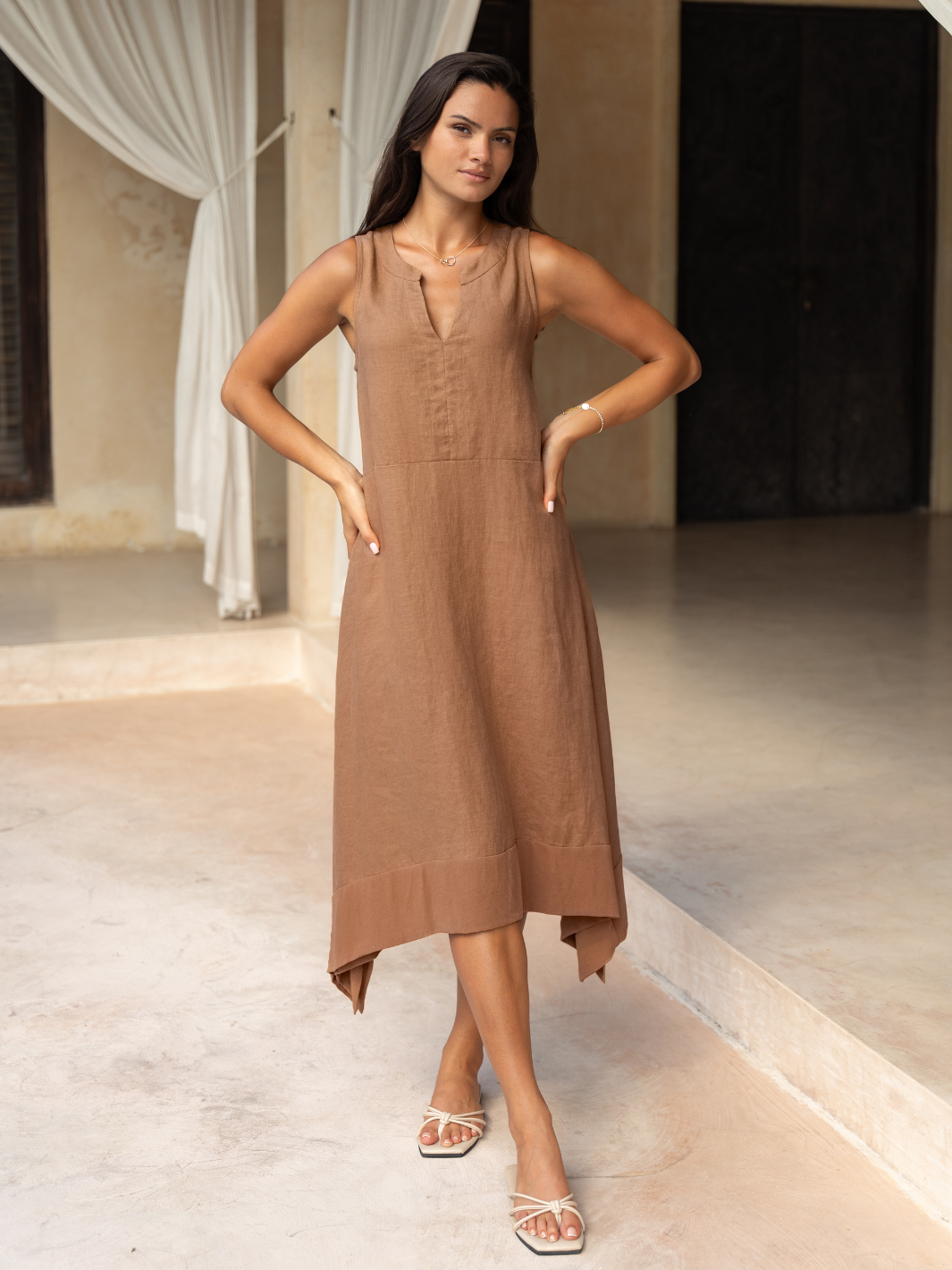 Model wears Inez Linen Midi Dress in Desert Sand