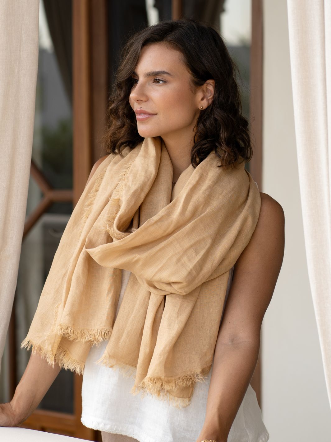 Model is wearing Omari Linen Scarf in Sand