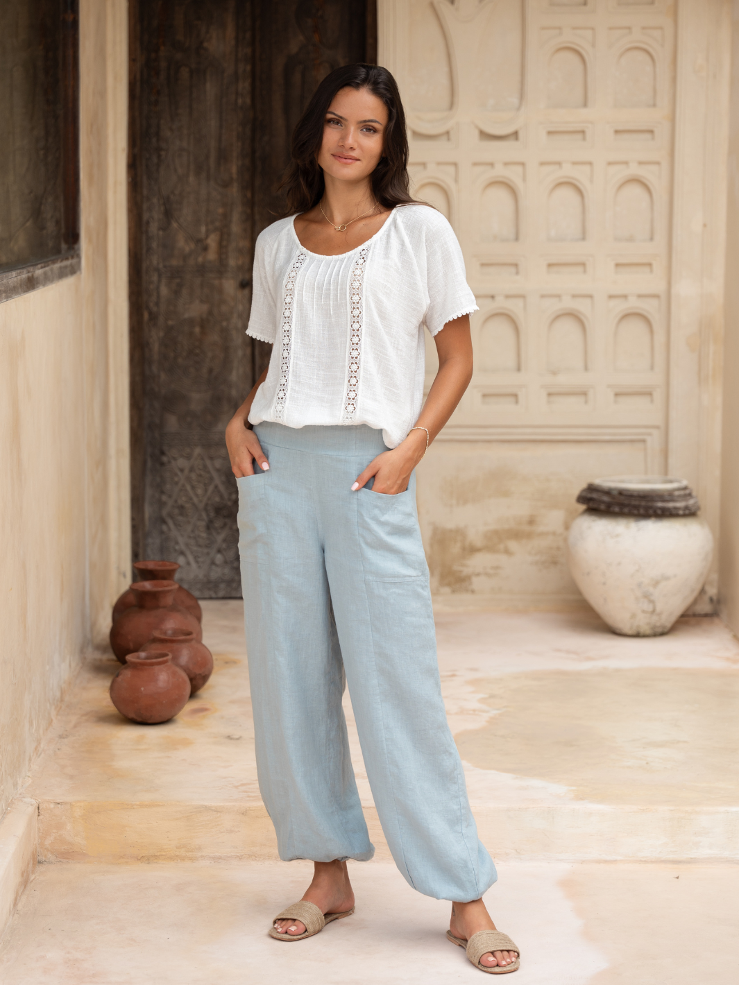 Model wears Malibu Linen Pants in Slate Blue