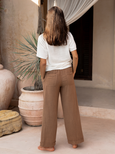 Model wears Sancia Cotton Pants in Desert Sand