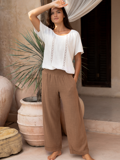 Model wears Sancia Cotton Pants in Desert Sand