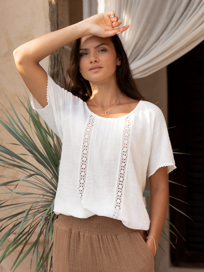 Model wears Daisy Organic Cotton Blouse in Ivory