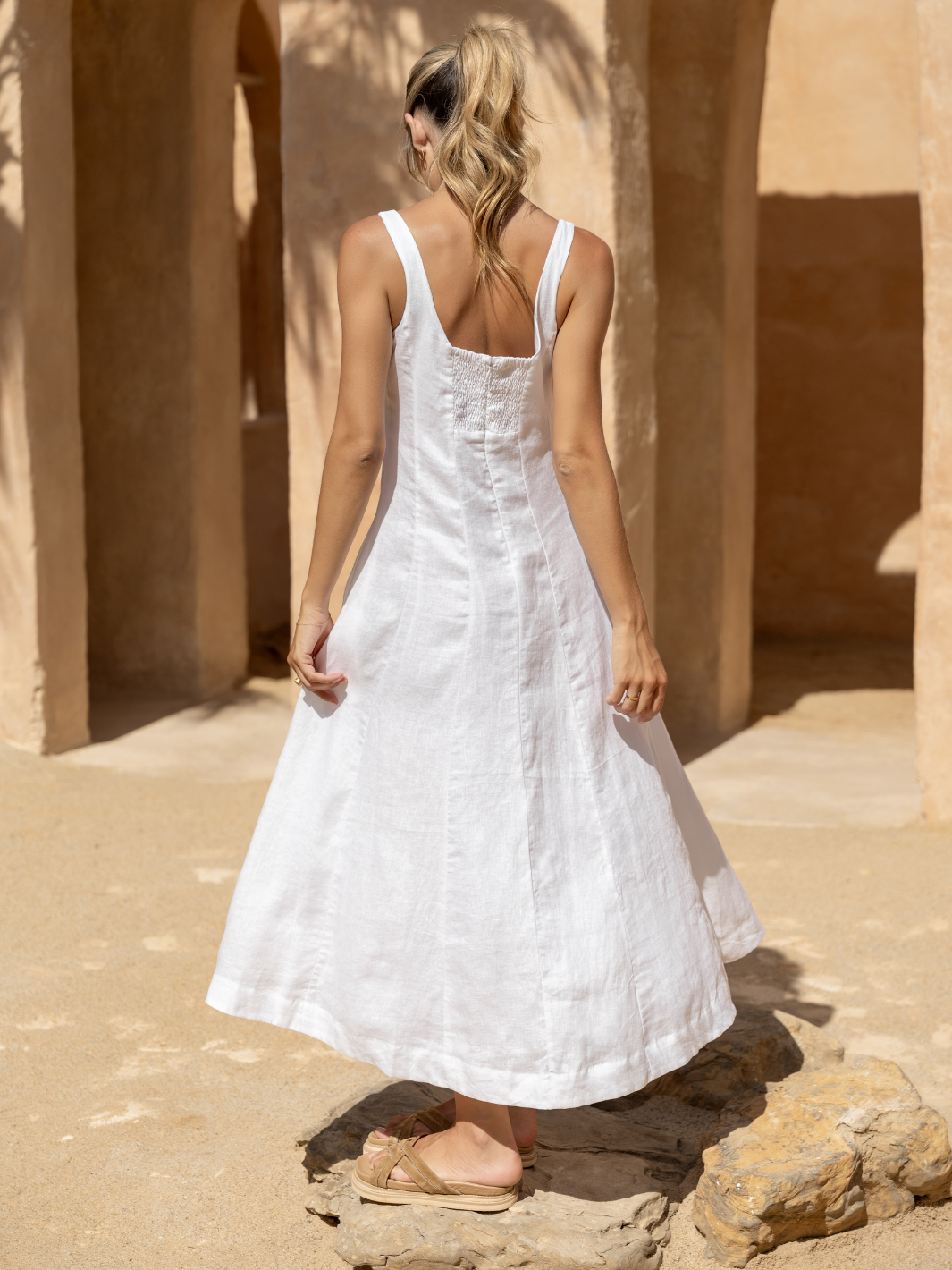 Model wears Rosalina Linen Midi Dress in White