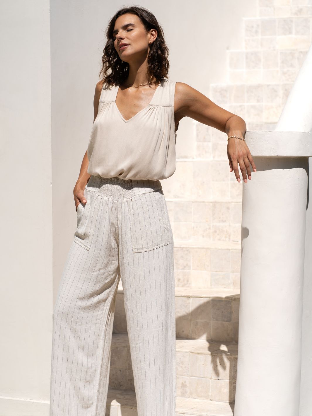 Model is wearing Del Mar Linen Blend Pants in Black Pinstripe