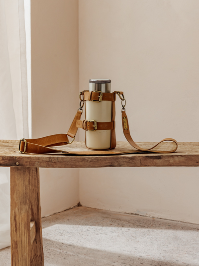 Model wears Walkabout Leather Bottle Holder in Tan