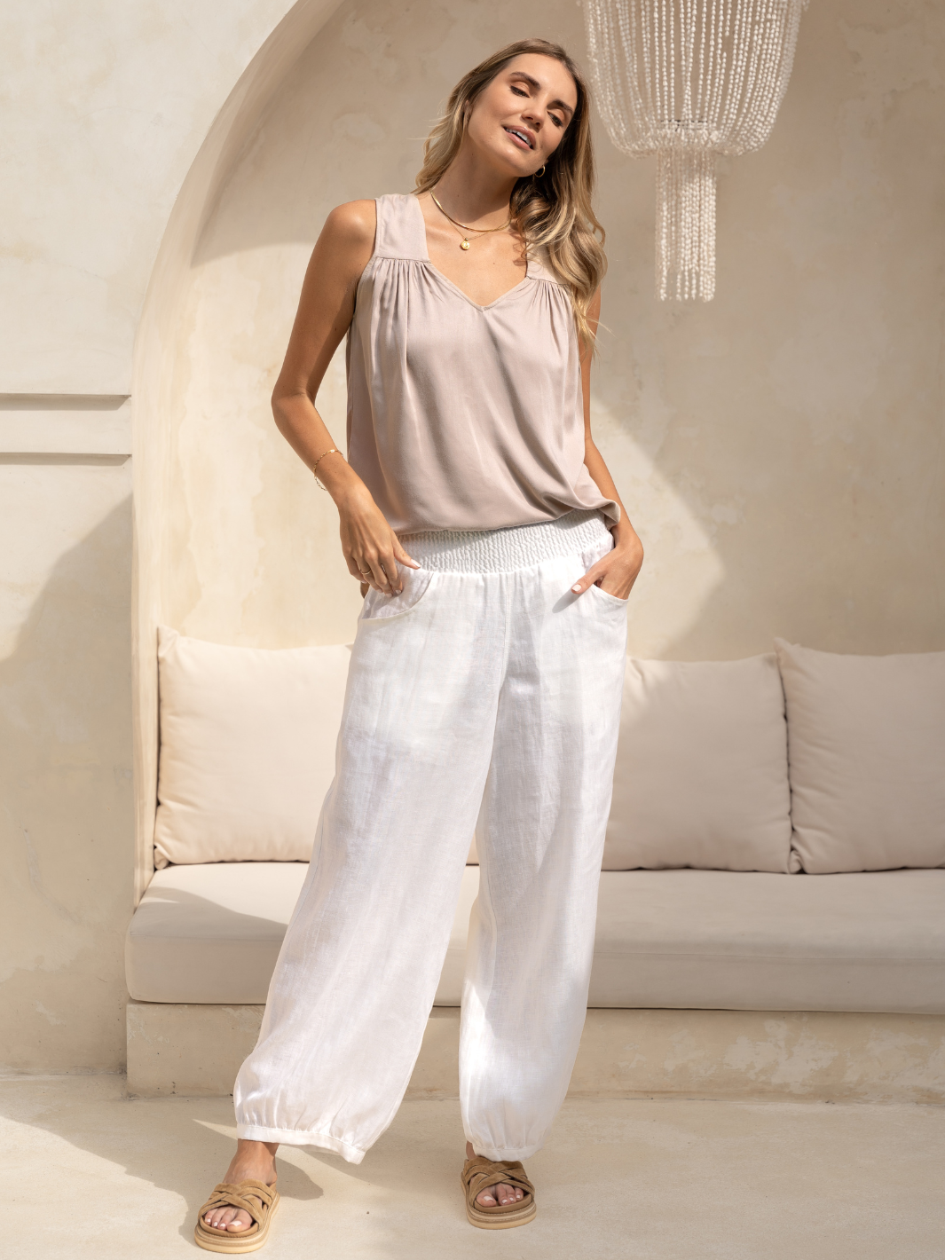 Model wears Sadhu French Linen Pants  Tall in White