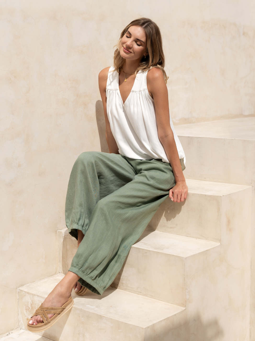 Model wears Sadhu French Linen Pants Tall in Moss