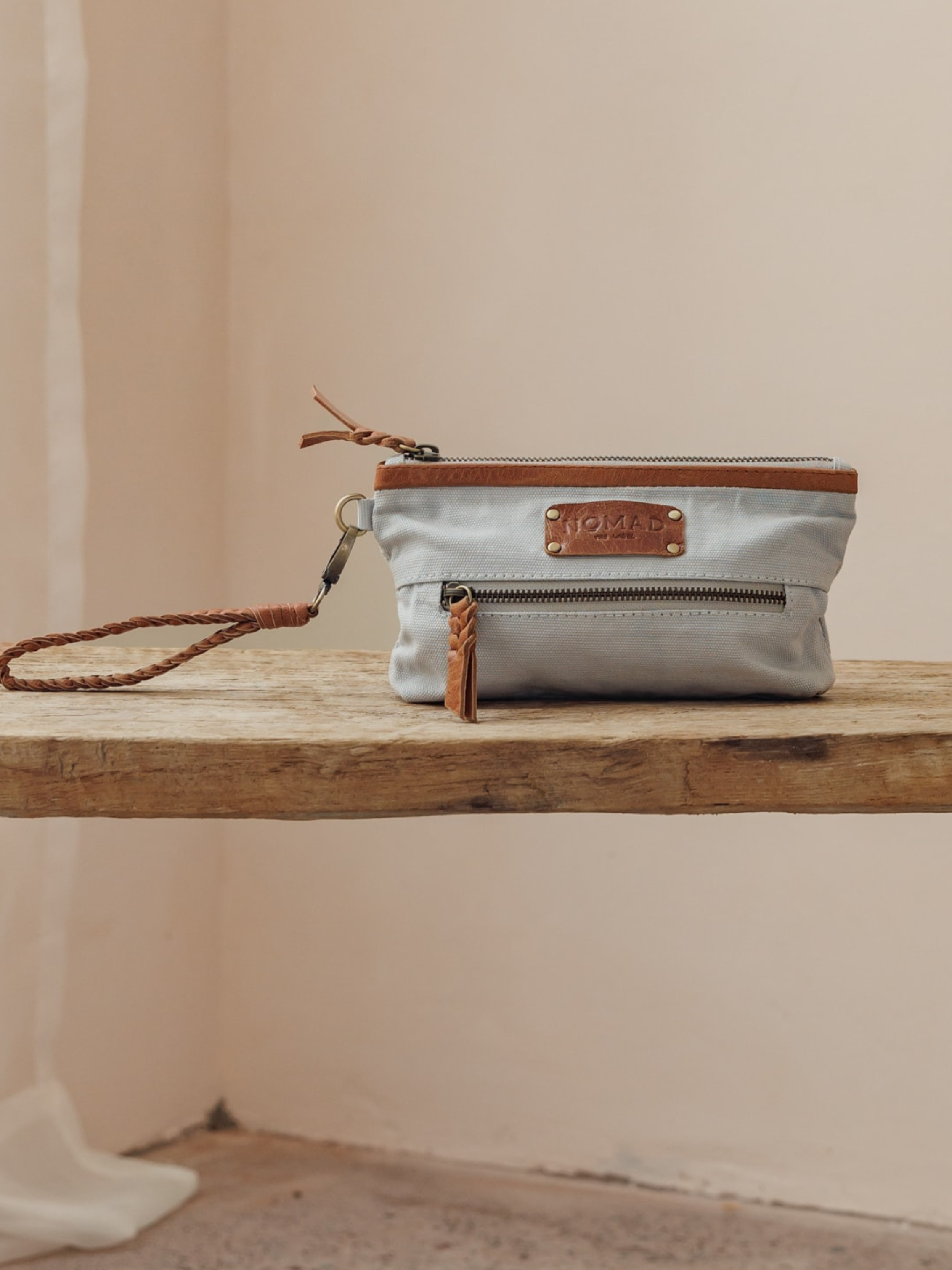 Image features Avalon Canvas Clutch in  Slate Blue.