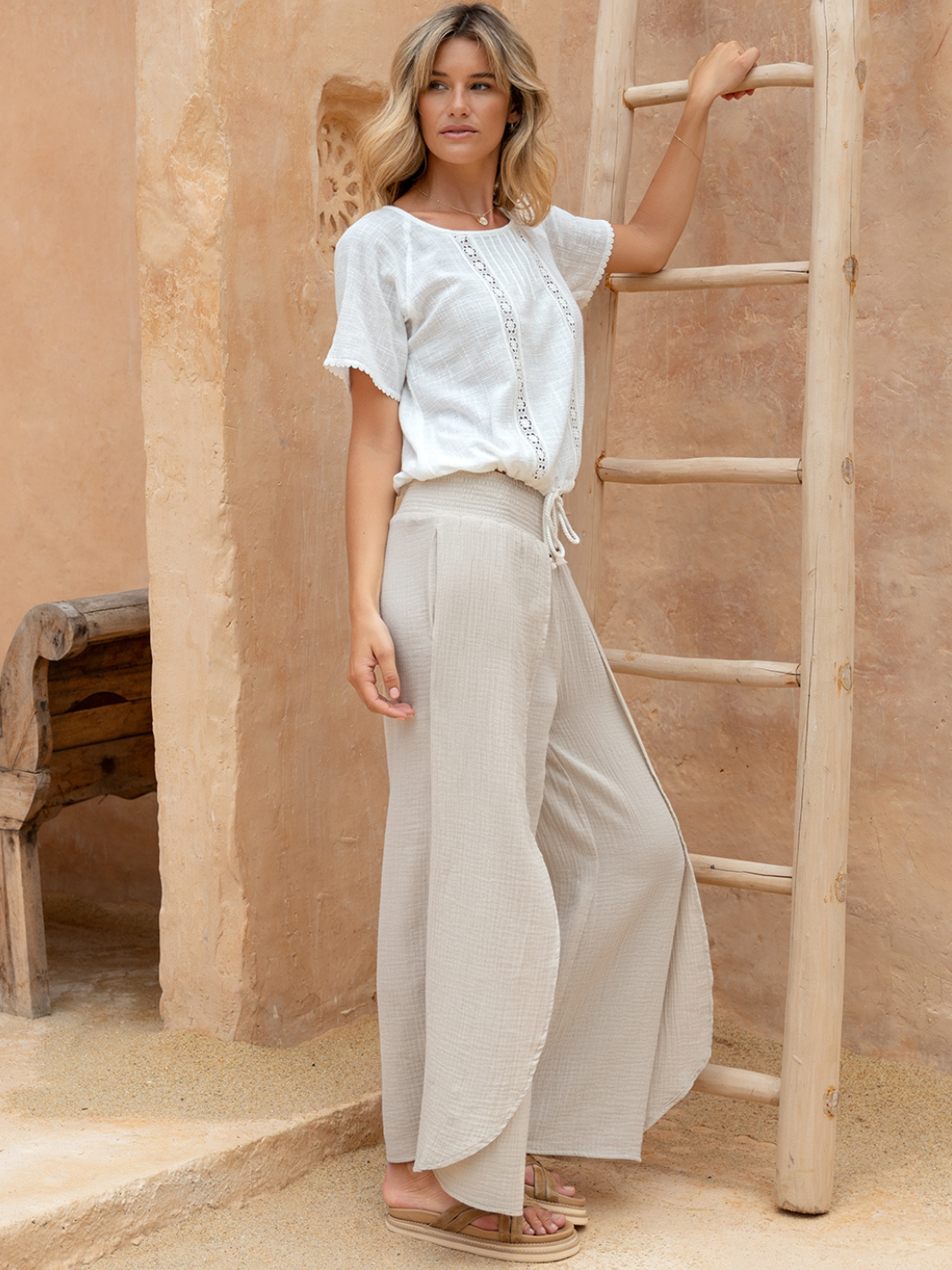 Model wears Asana Cotton Wrap Pants in Stone