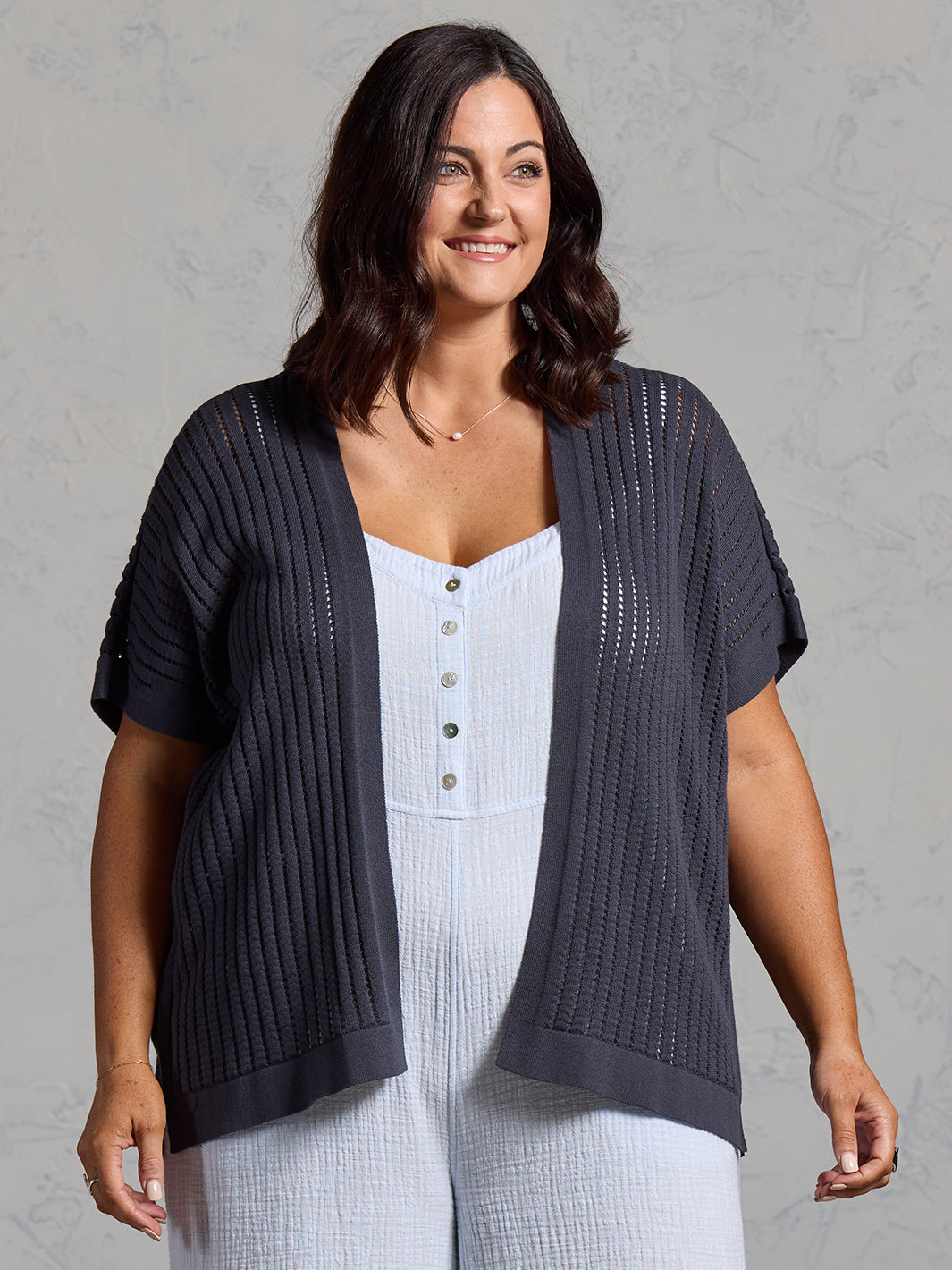 A woman wearing a charcoal cotton kimono from Nomad the Label