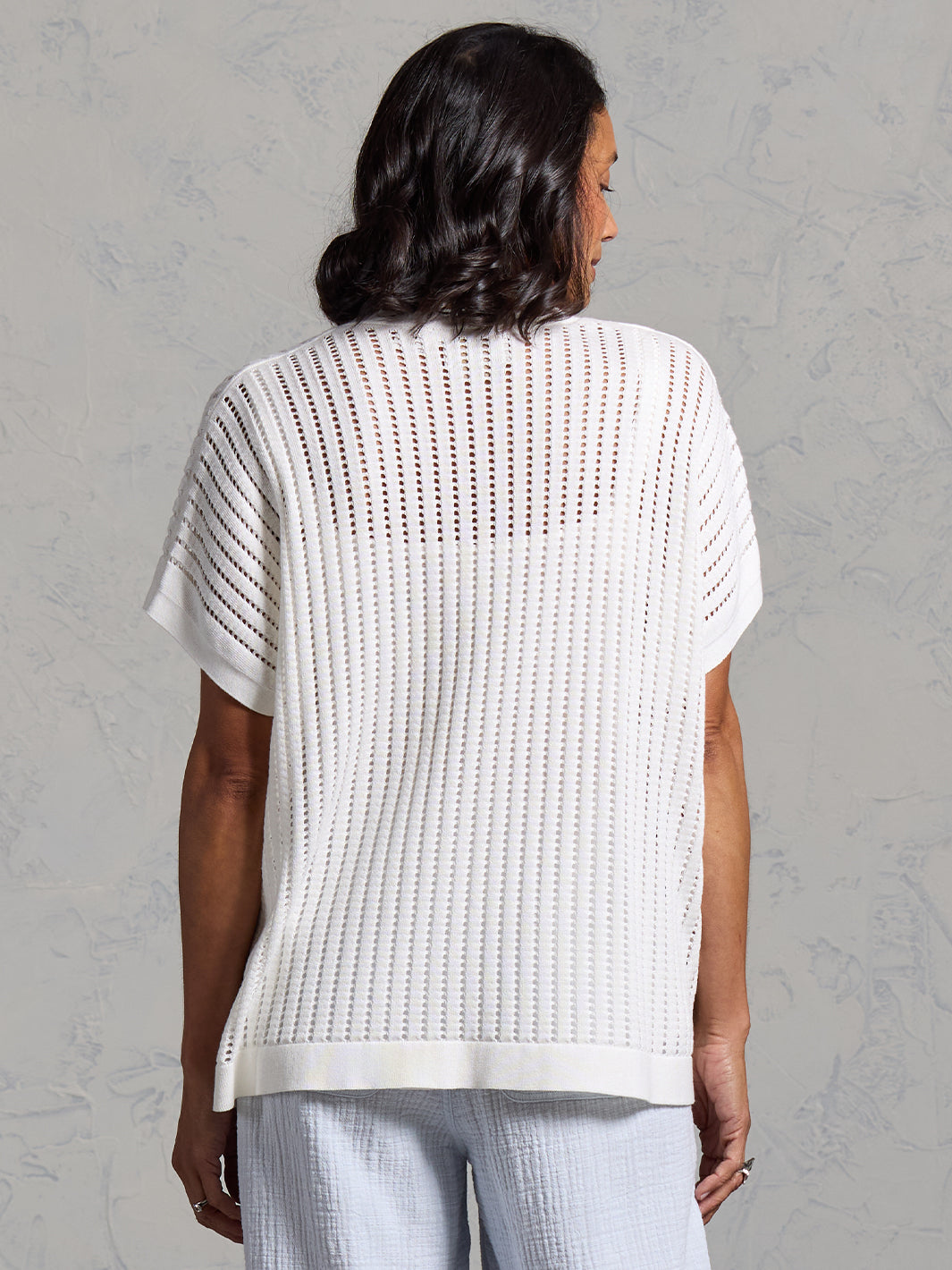 A woman wearing a coconut cotton kimono from Nomad the Label