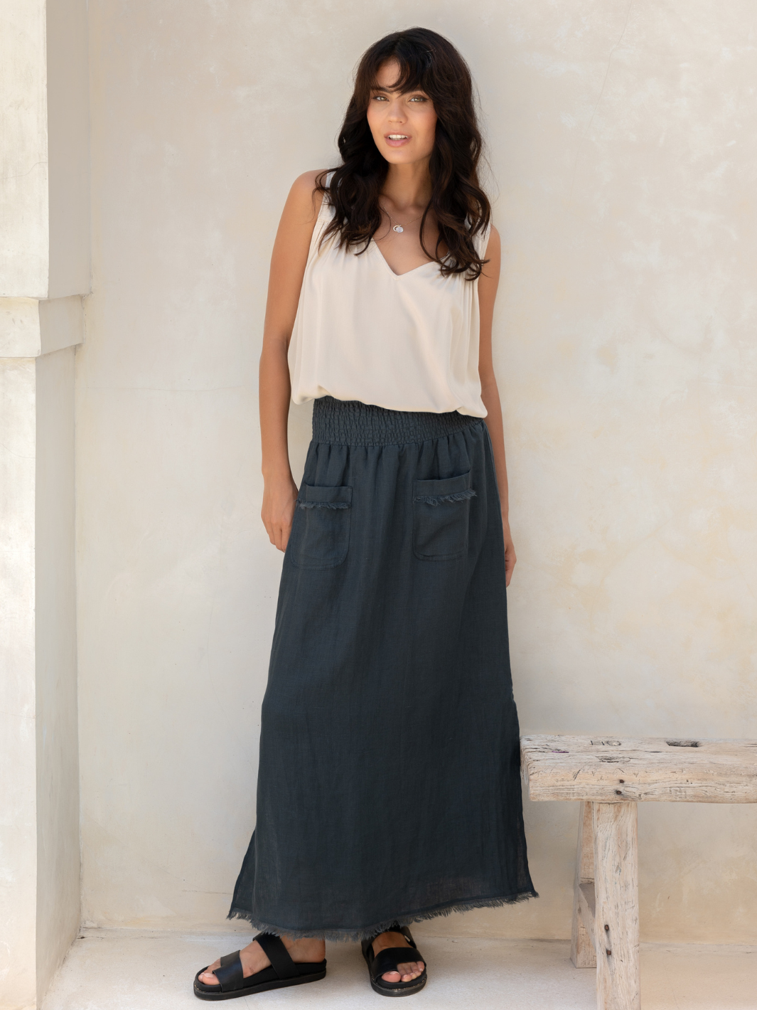 Model wears Aurora French Linen Skirt in Charcoal