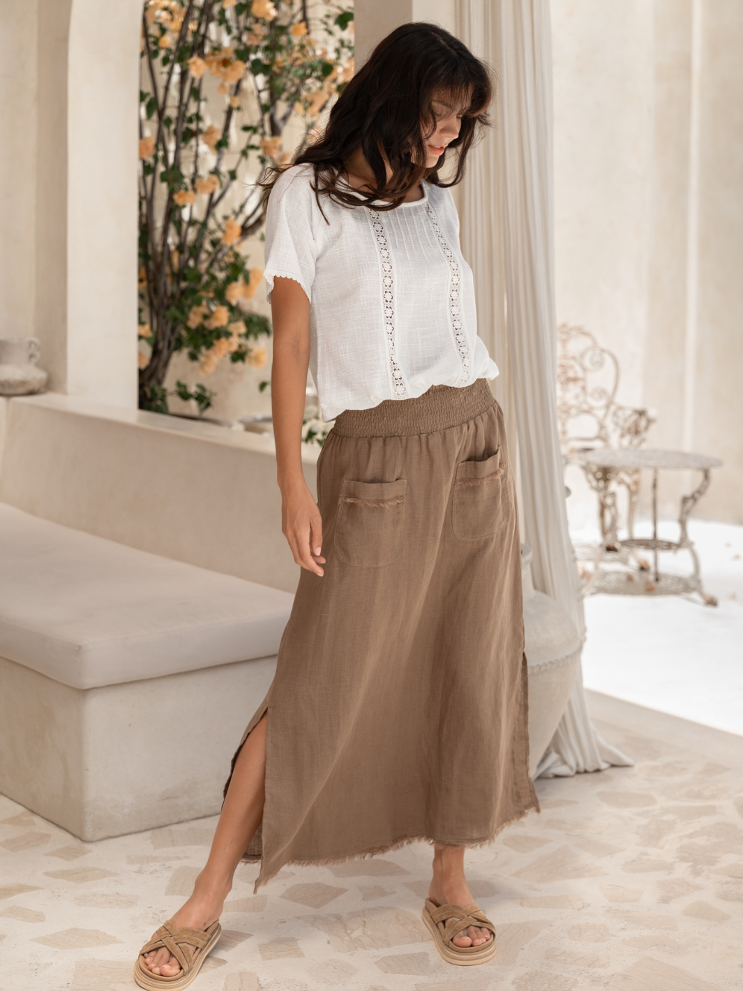 Model wears Aurora French Linen Skirt in Cinnamon