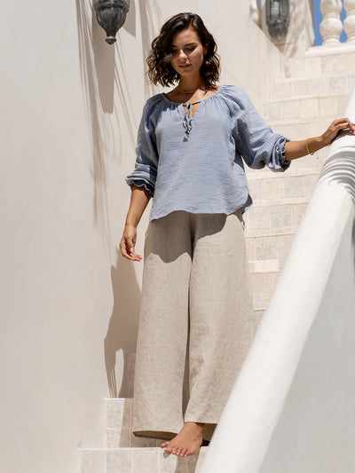 Model wears Capri Cotton Blouse in Slate Blue