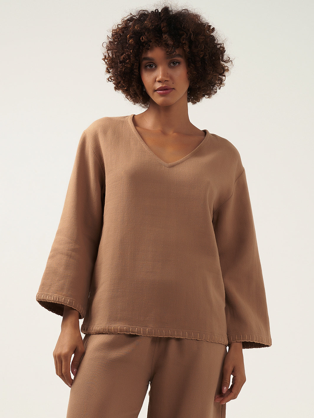 Model wears Cari Ramie Top in Desert Sand