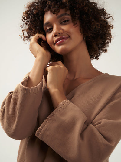 Model wears Cari Ramie Top in Desert Sand