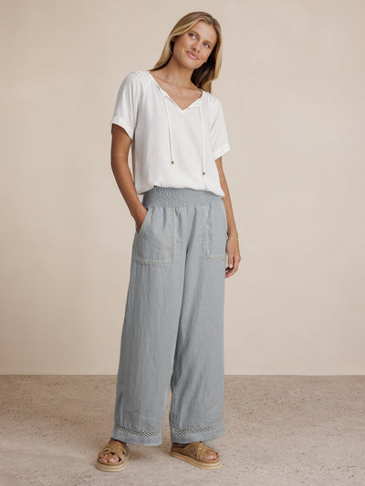 Model wears Cebu Linen Pants in Slate Blue