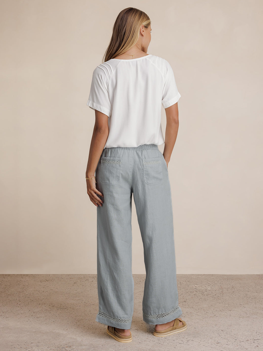 Model wears Cebu Linen Pants in Slate Blue