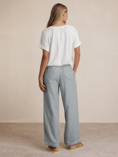 Model wears Cebu Linen Pants in Slate Blue