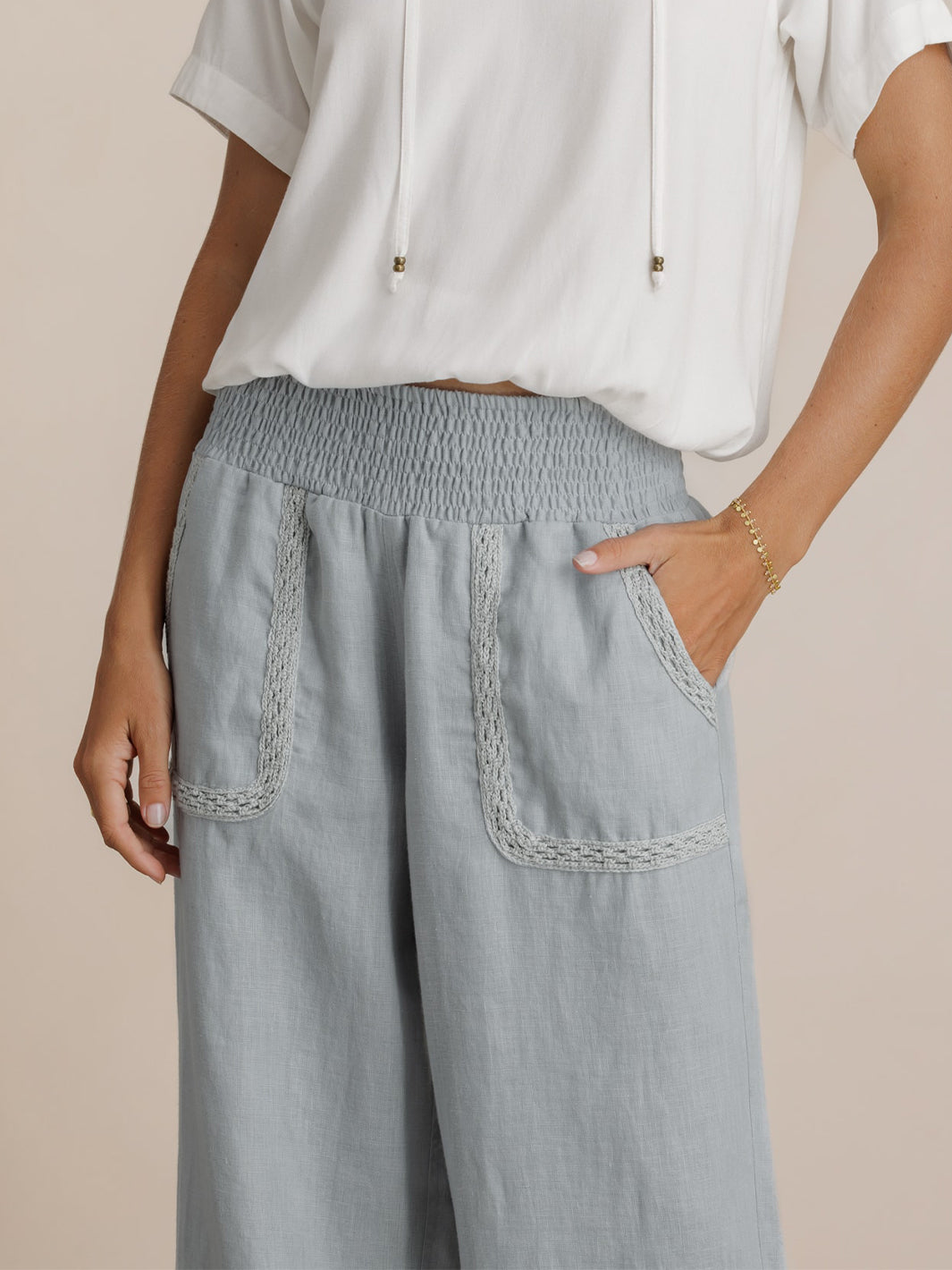 Model wears Cebu Linen Pants in Slate Blue