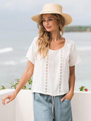 Model wears Daisy Organic Cotton Blouse in Ivory