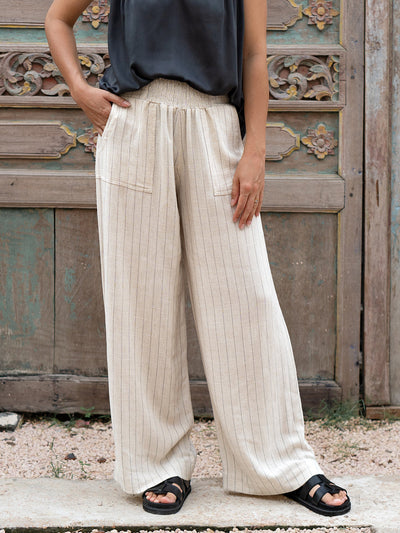 Model is wearing Del Mar Linen Blend Pants in Black Pinstripe