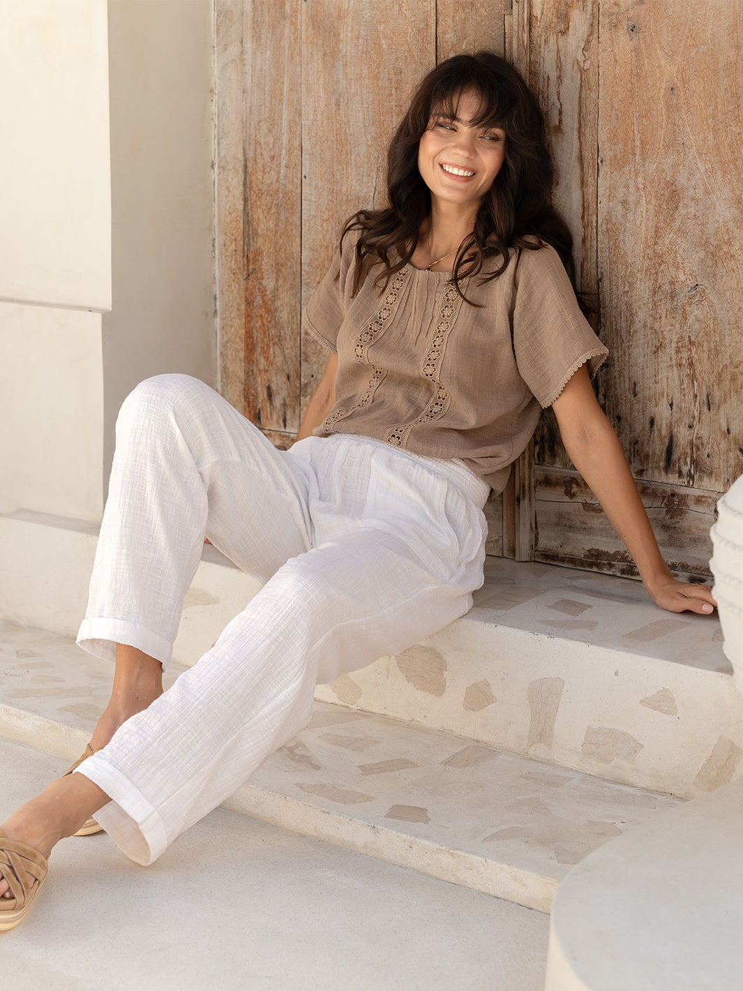 Model wears Delphi Cotton Pants in Ivory