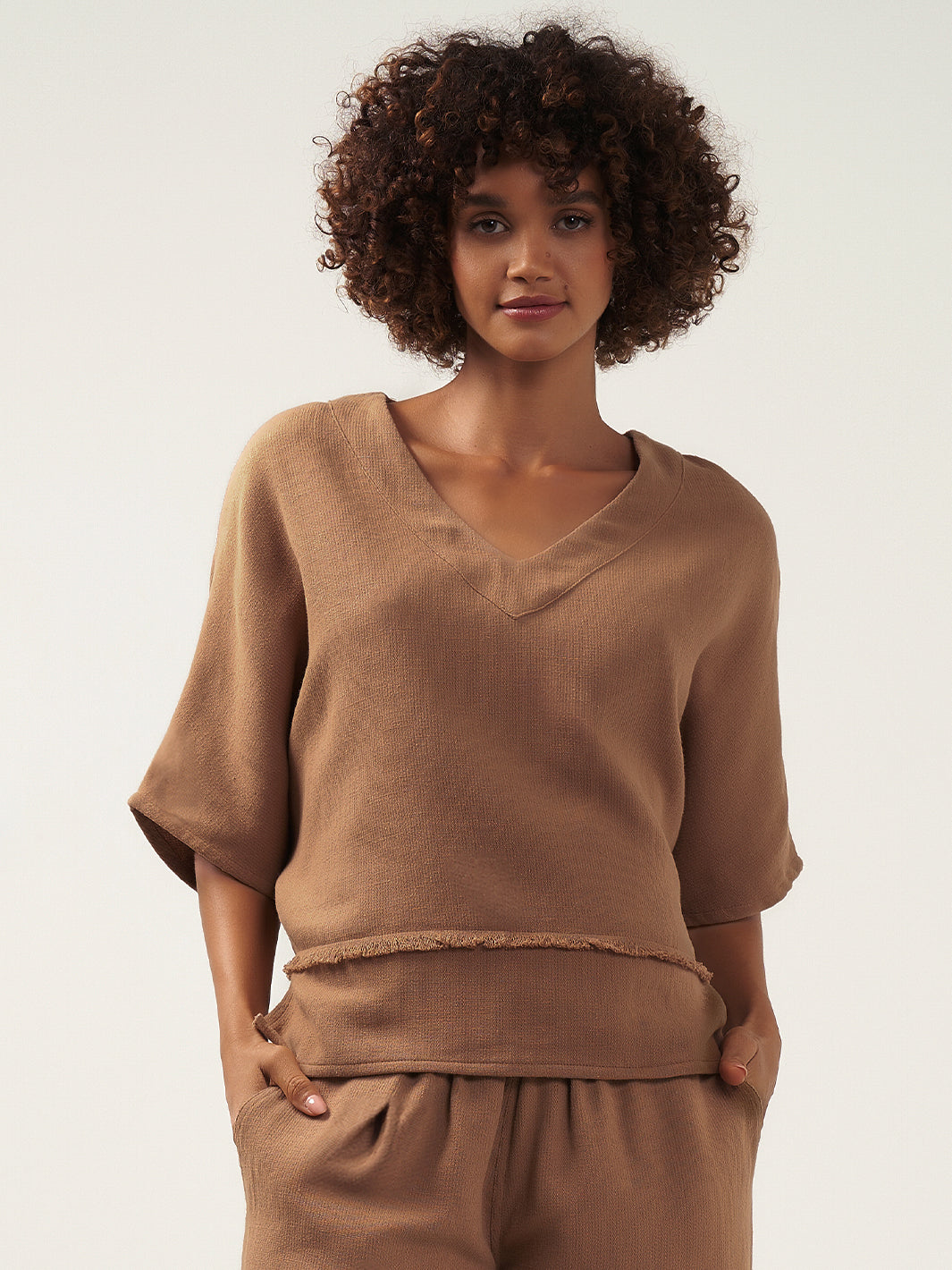 Model wears Floris Ramie Top in Desert Sand