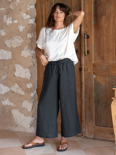 Model is wearing Gaia Linen Pants in Charcoal