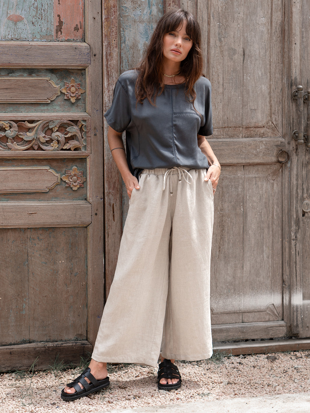 Model is wearing Gaia Linen Pants in Flax