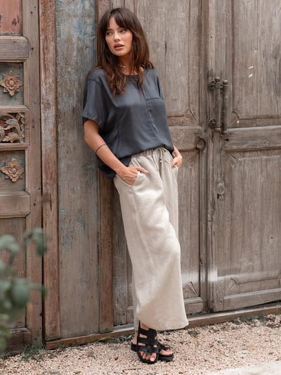 Model is wearing Gaia Linen Pants in Flax