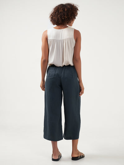 Model is wearing Gaia Linen Pants in Charcoal