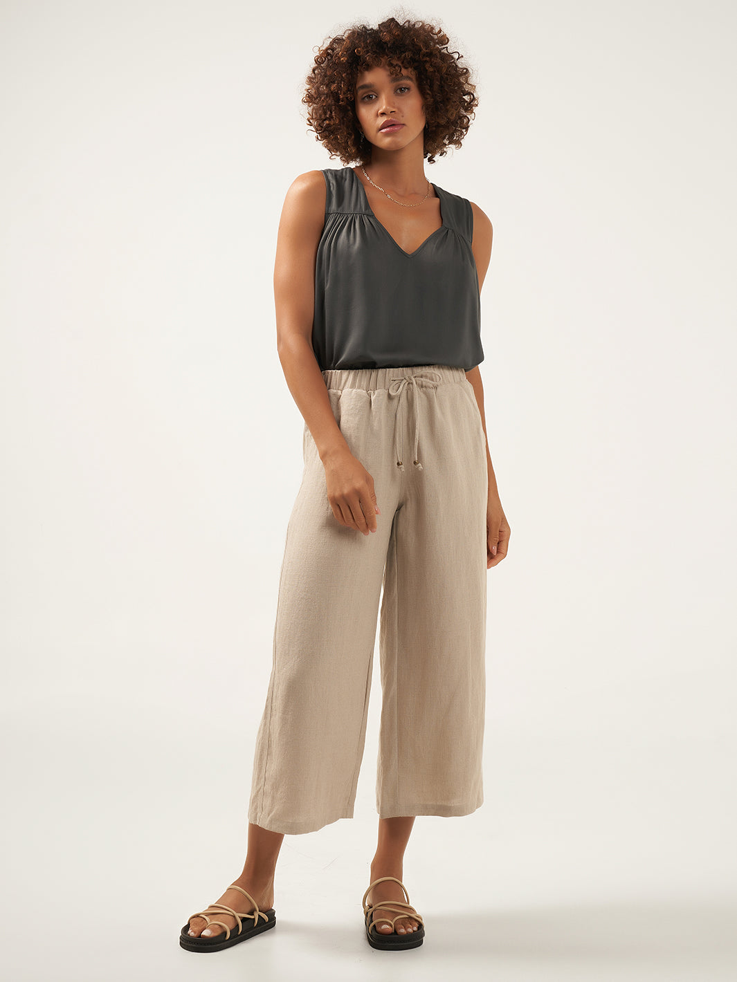 Model is wearing Gaia Linen Pants in Flax