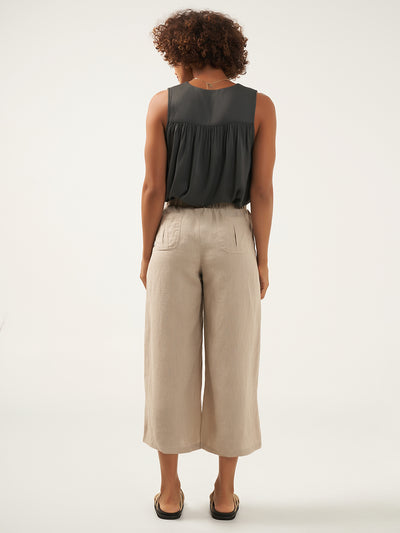 Model is wearing Gaia Linen Pants in Flax