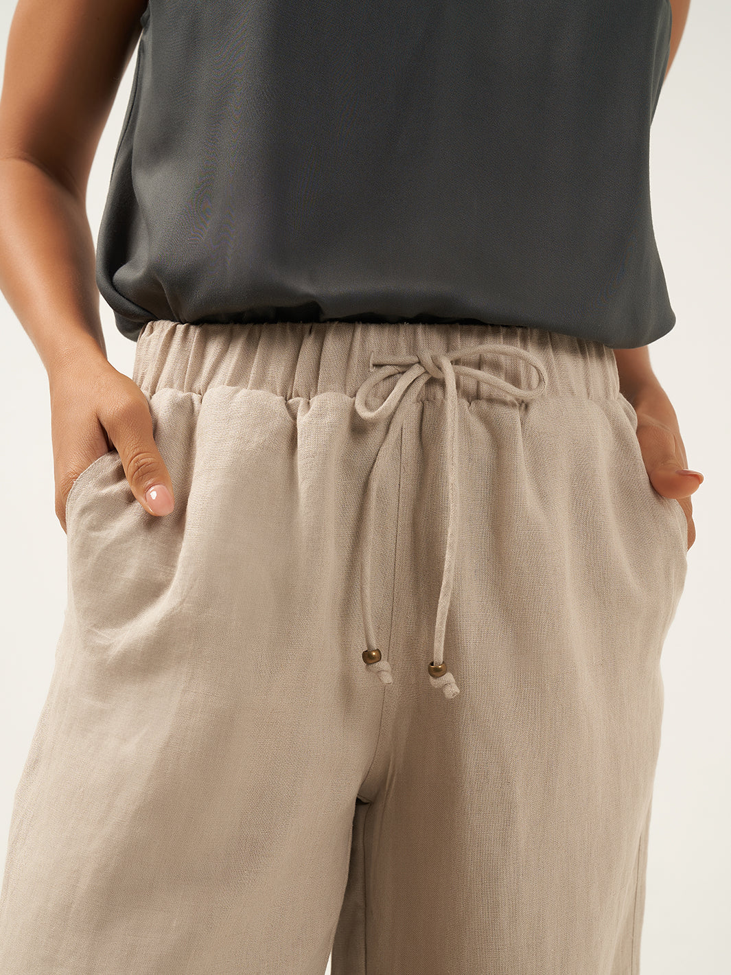 Model is wearing Gaia Linen Pants in Flax