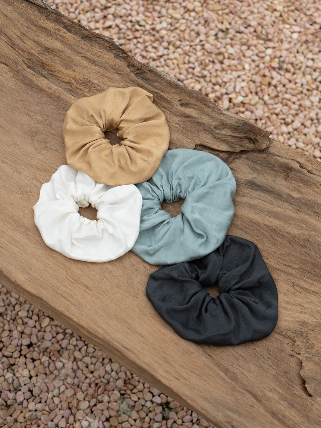 Image features Jumbo Bamboo Scrunchie in Charcoal, Ivory, Sand and Steel Blue