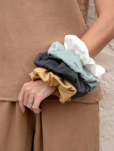 Image features Jumbo Bamboo Scrunchie in Charcoal, Ivory, Sand and Steel Blue